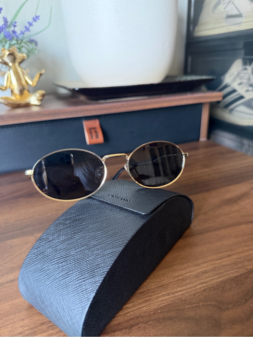Prada Gold Frame Black Lens Oval Sunglasses